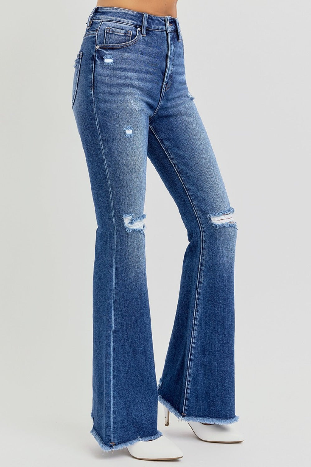 Side view of distressed wide-leg flare jeans