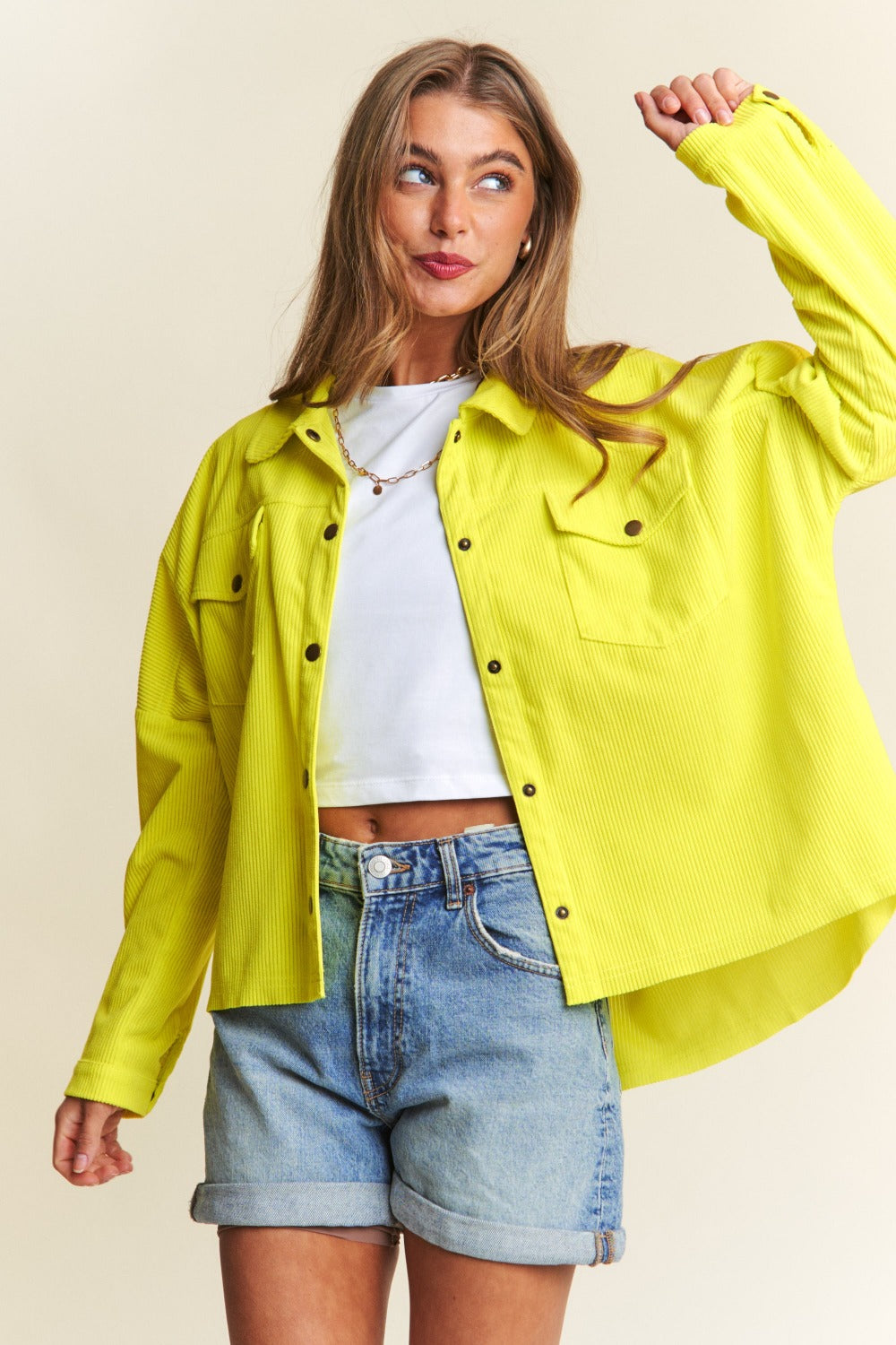 Limonette Glow Shacket in chartreuse, playful pose.