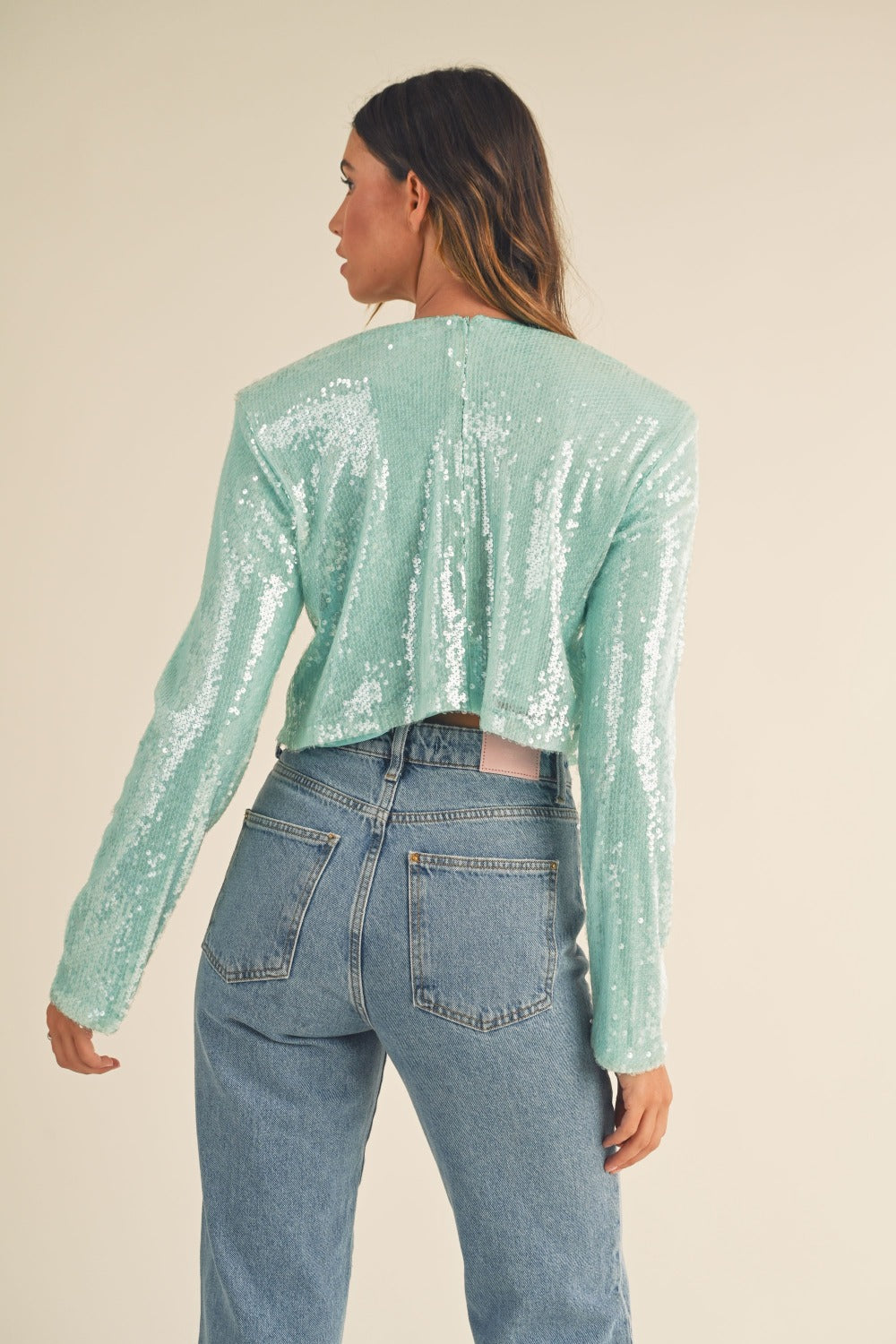 Green shoulder padded sequin crop top, back view