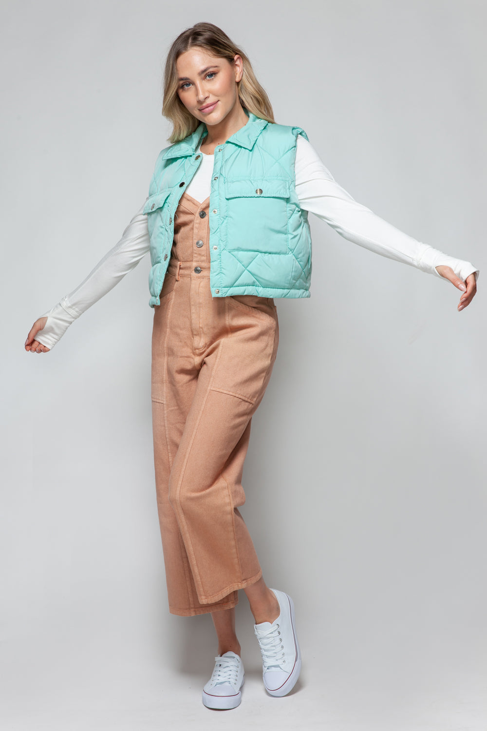 Full outfit with turquoise quilted crop vest and overalls