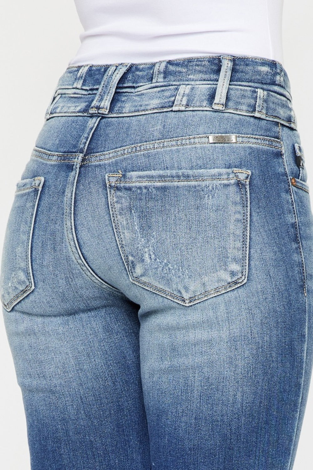 Close-up of Zephyr Curve Flare jeans back pockets