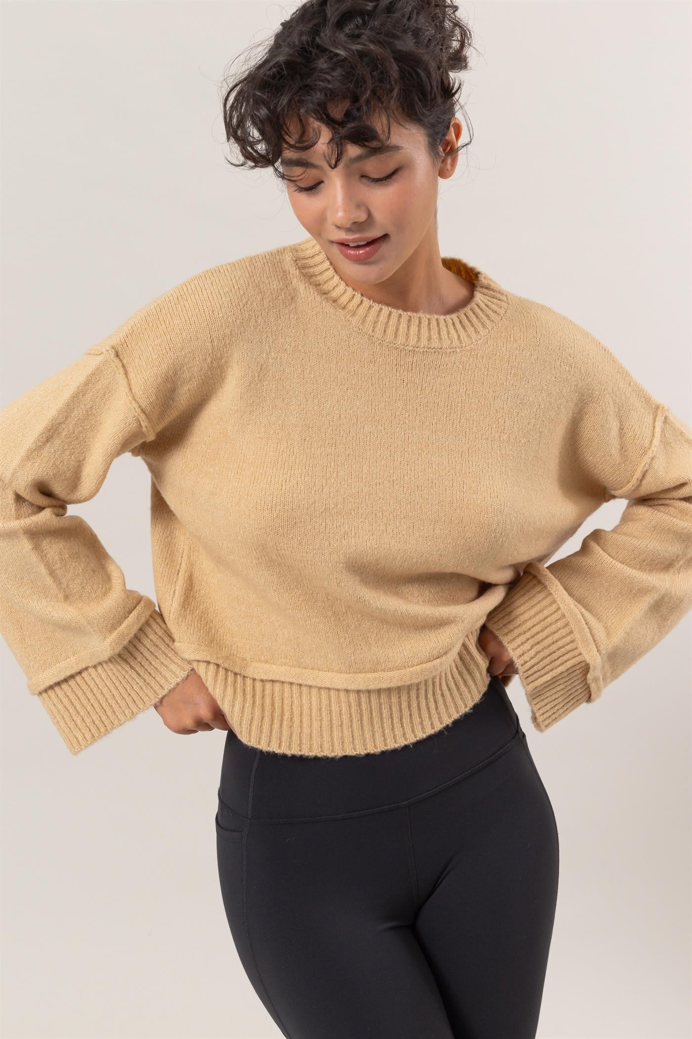 Beige ribbed sweater with crew neck, front view