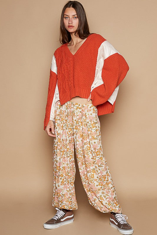 Autumnal Elegance Knit Top paired with floral pants