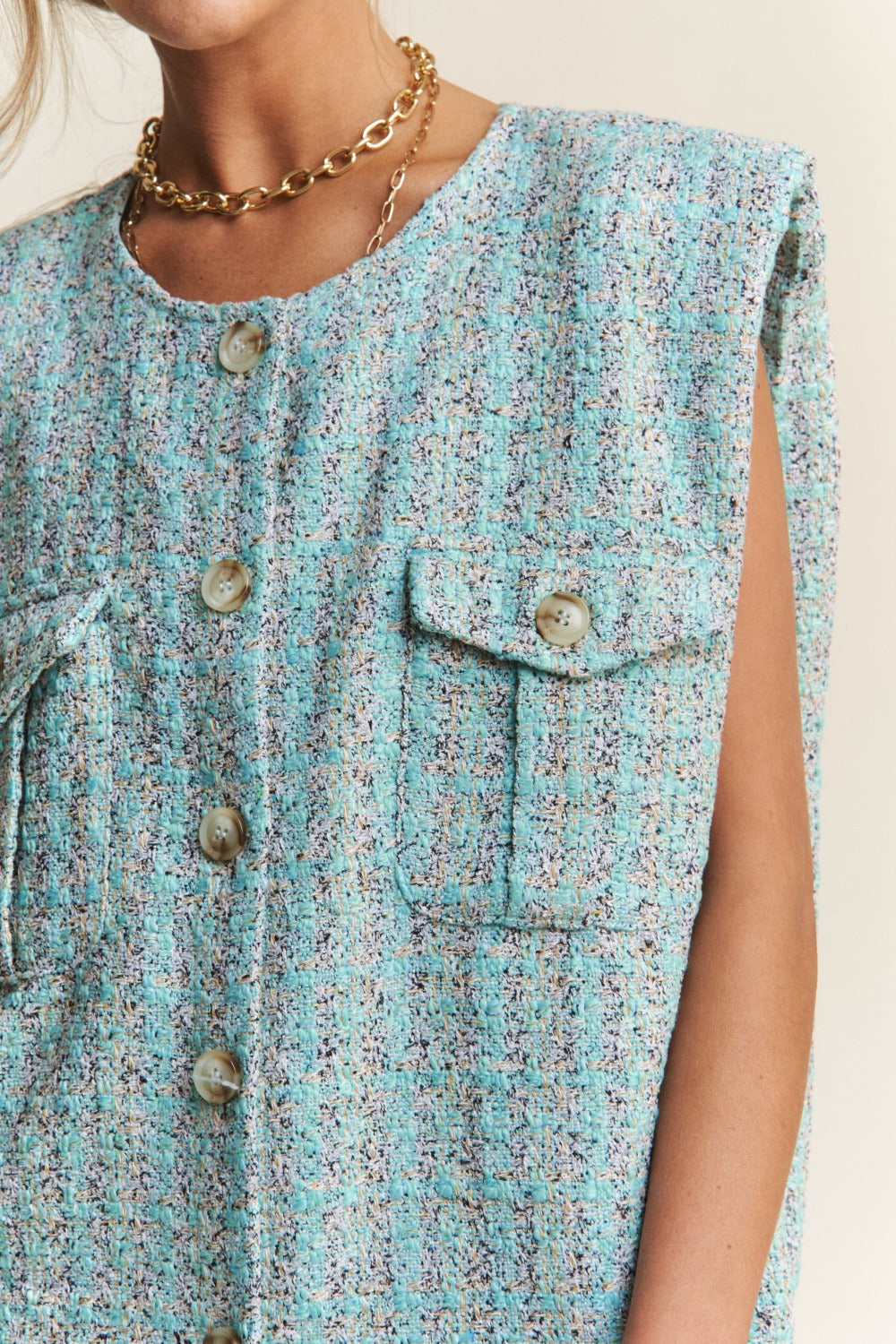 Close-up of Celeste Blue Tweed Vest with button and pocket details