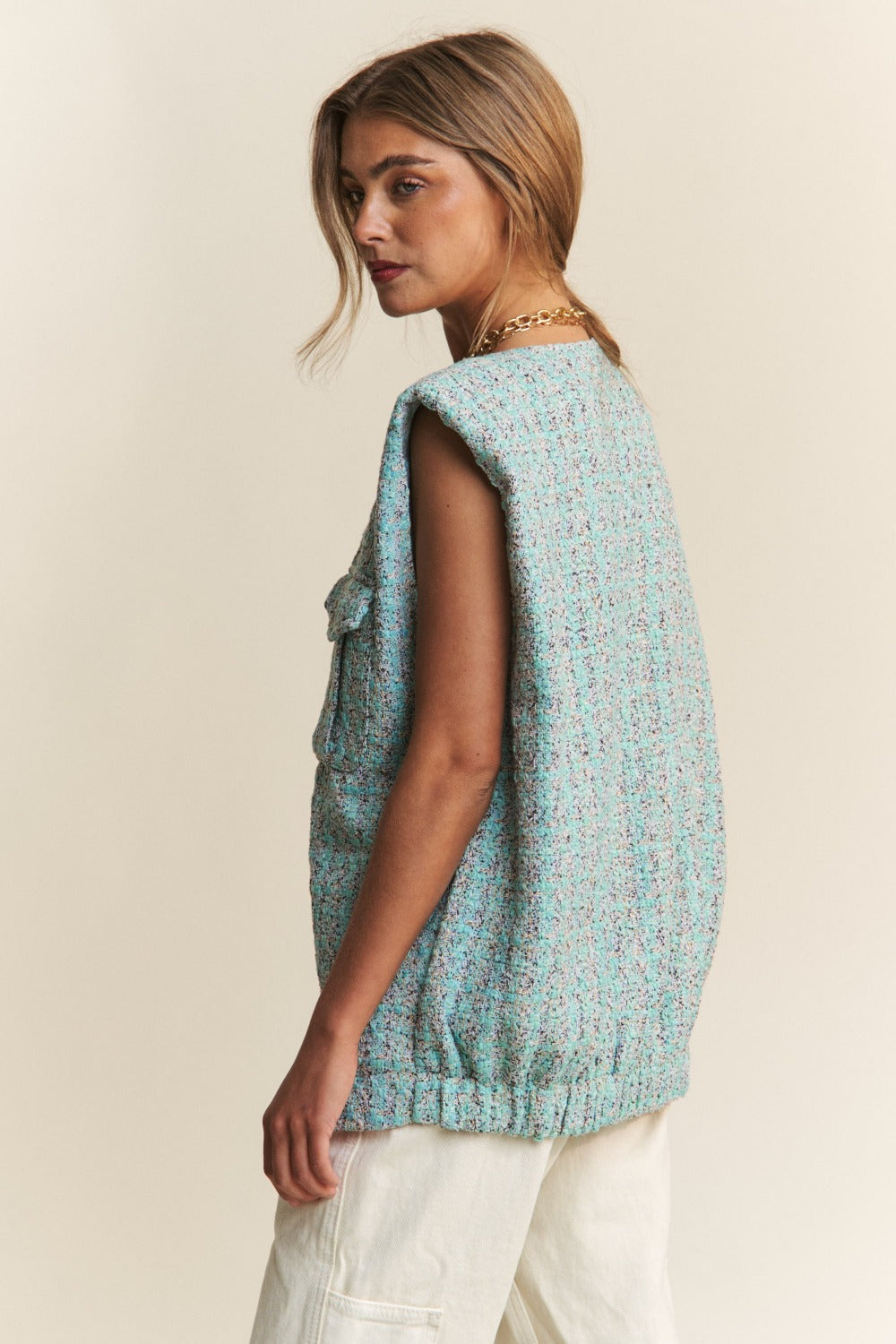 Side view of Celeste Blue Tweed Vest with padded shoulders