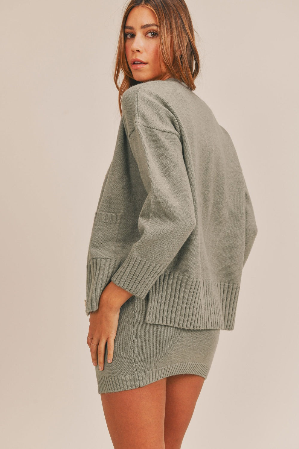 Back view of dusty olive sweater set with cardigan