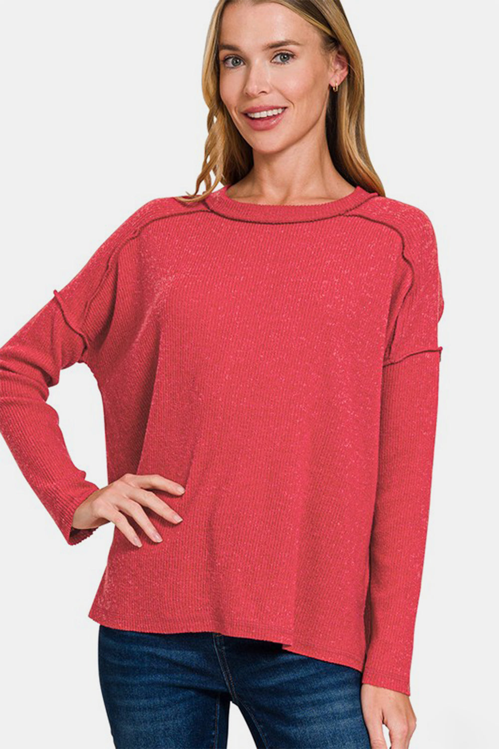 Éclat Scarlet Seam Sweater front view with exposed seams