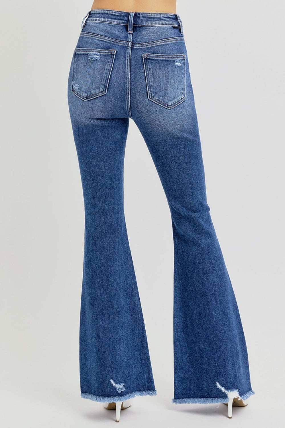 Back view of high-rise distressed flare jeans