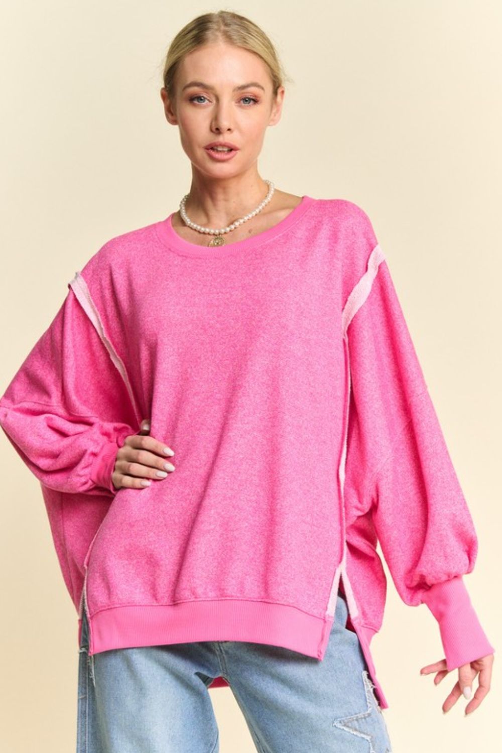 Pink high-low knit top with lantern sleeves, front view