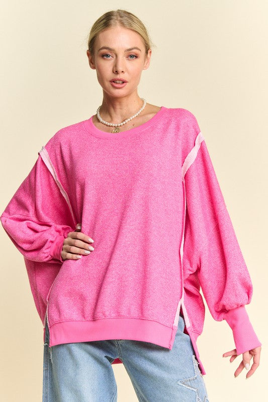 Pink high-low knit top with lantern sleeves, front view