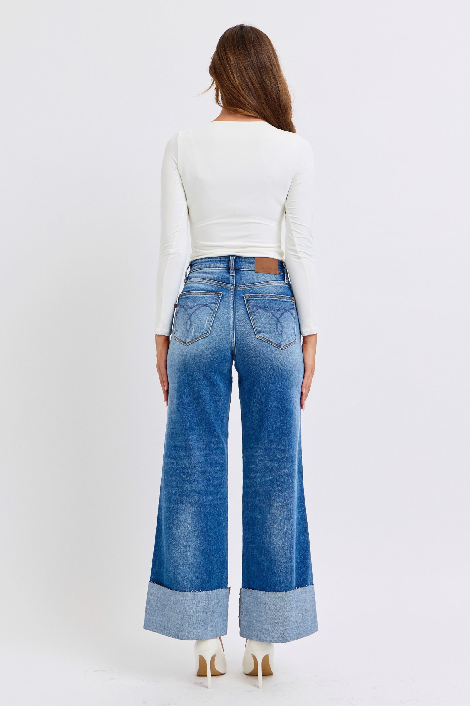 Back view of model in Elysian Distressed Wide-Leg Denim jeans