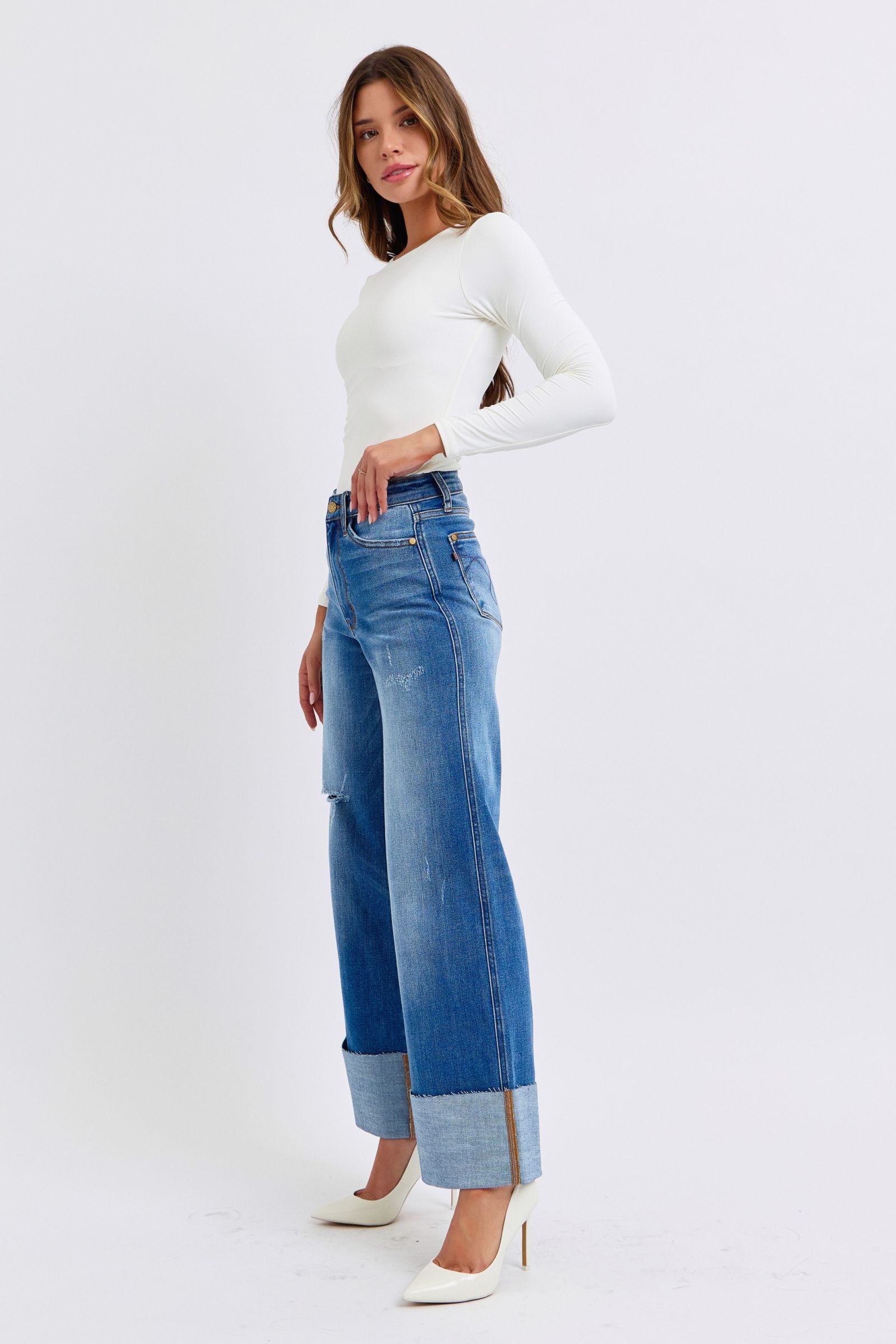 Model side pose in Elysian Distressed Wide-Leg Denim jeans