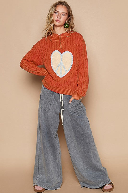 Full outfit with orange sweater and wide-leg pants