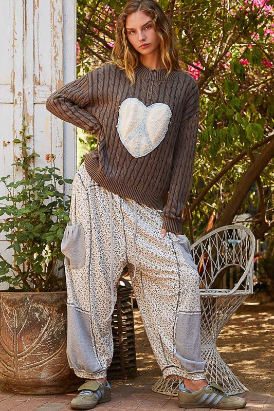 Bohemian style cable-knit sweater with peace patch