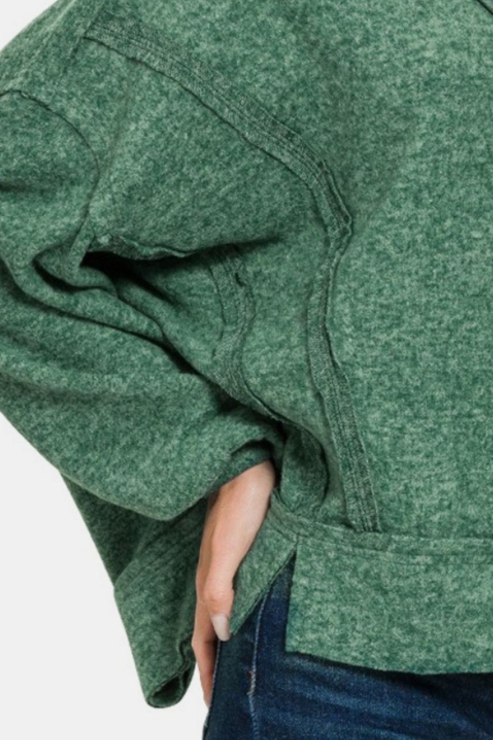 Close-up of green Étoile Luxe Hacci Hoodie fabric and sleeve