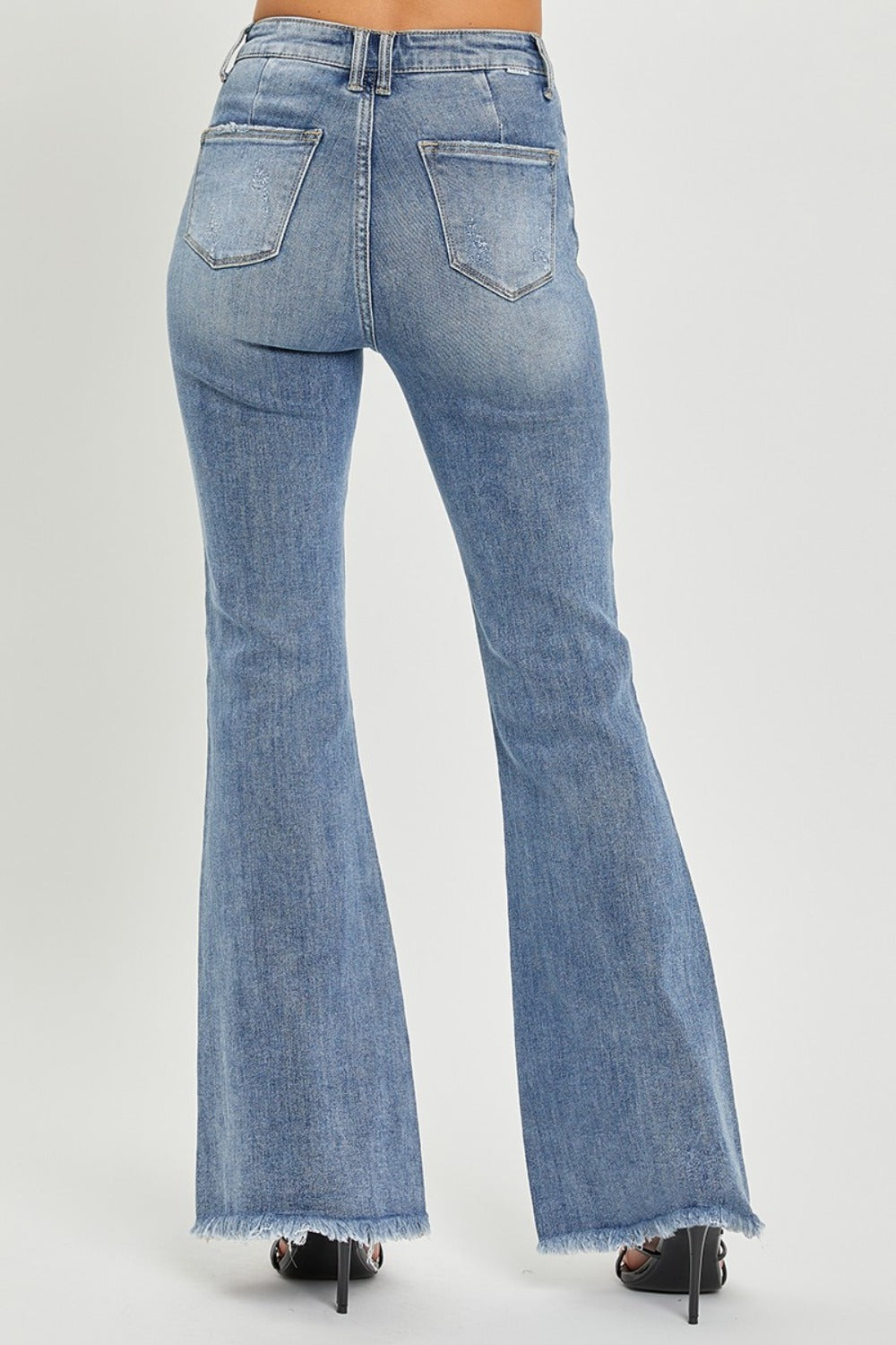 Back view of high waist raw hem flare jeans