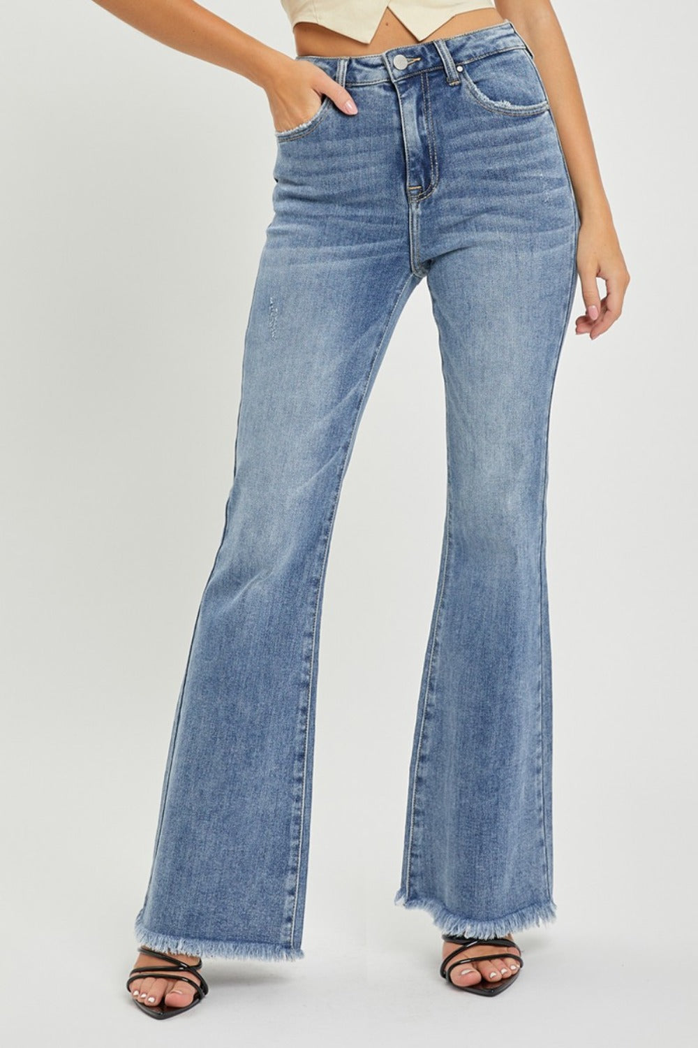 Front view of high waist raw hem flare jeans