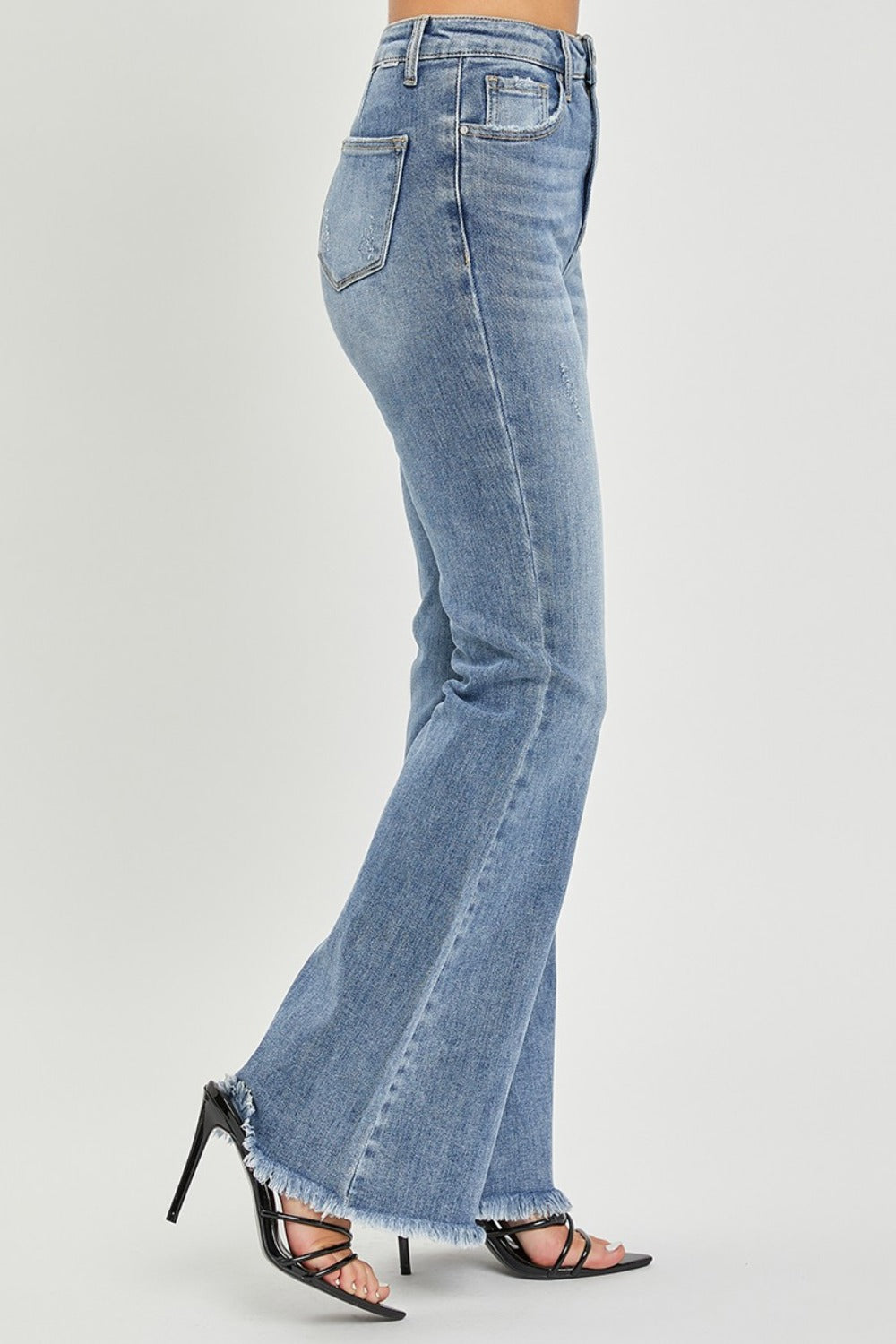 Side view of high waist raw hem flare jeans