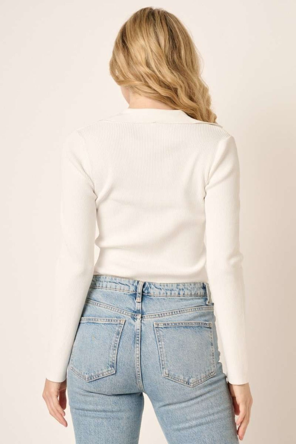 Ivory Luxe Polo Top back view, ribbed knit design.