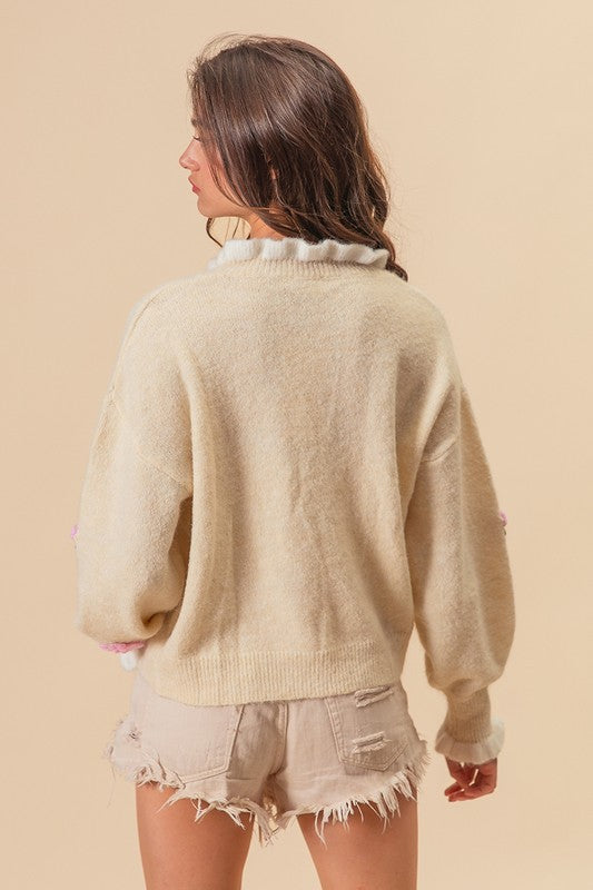 Ivory sweater with ruffled collar, back view