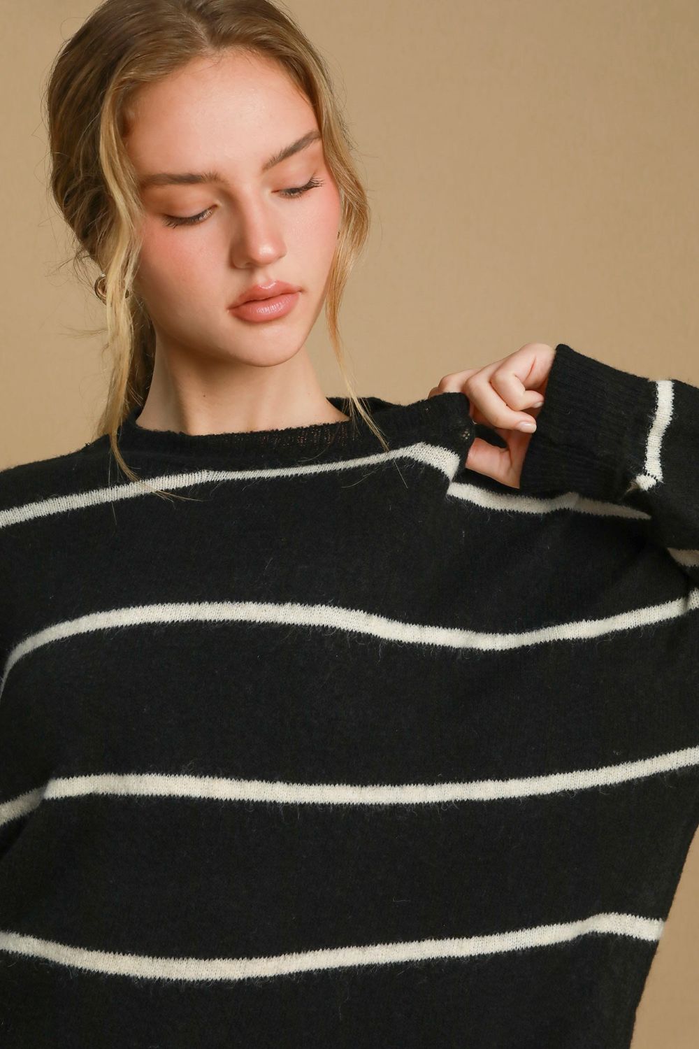 Close-up of black and cream striped wool sweater