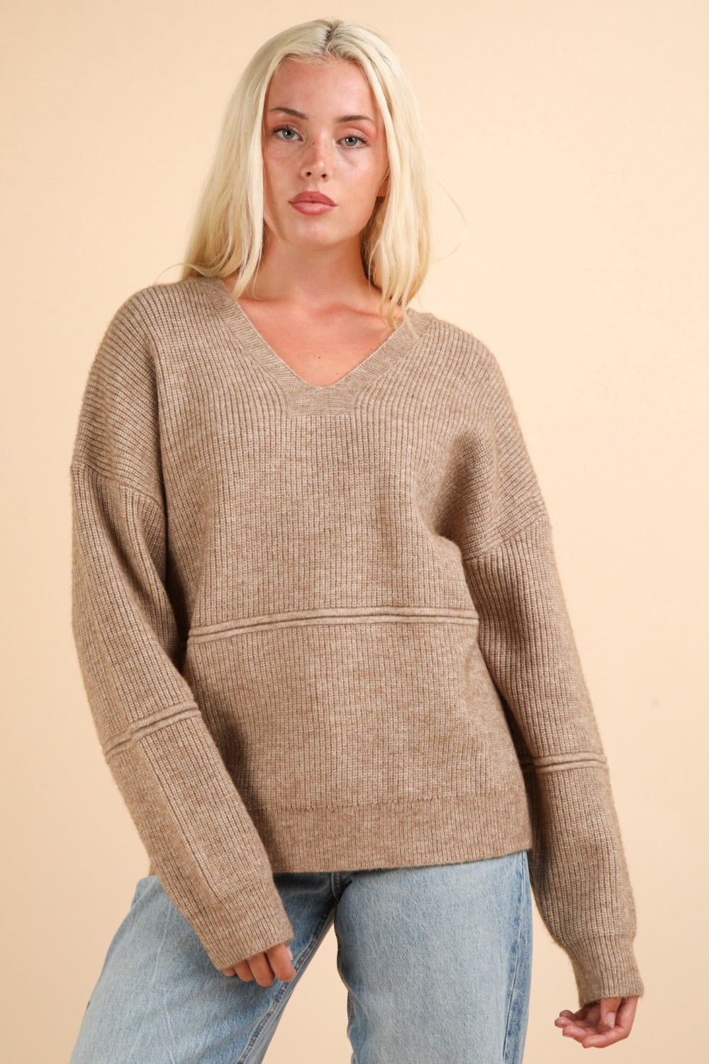 Front view of brown V-neck sweater with long sleeves