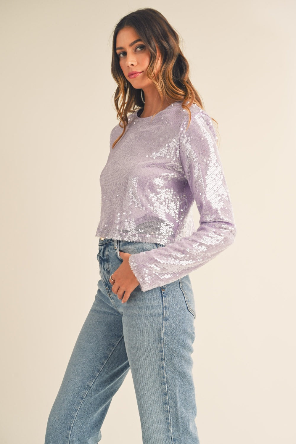 Lavender sequin crop top with shoulder pads, side view