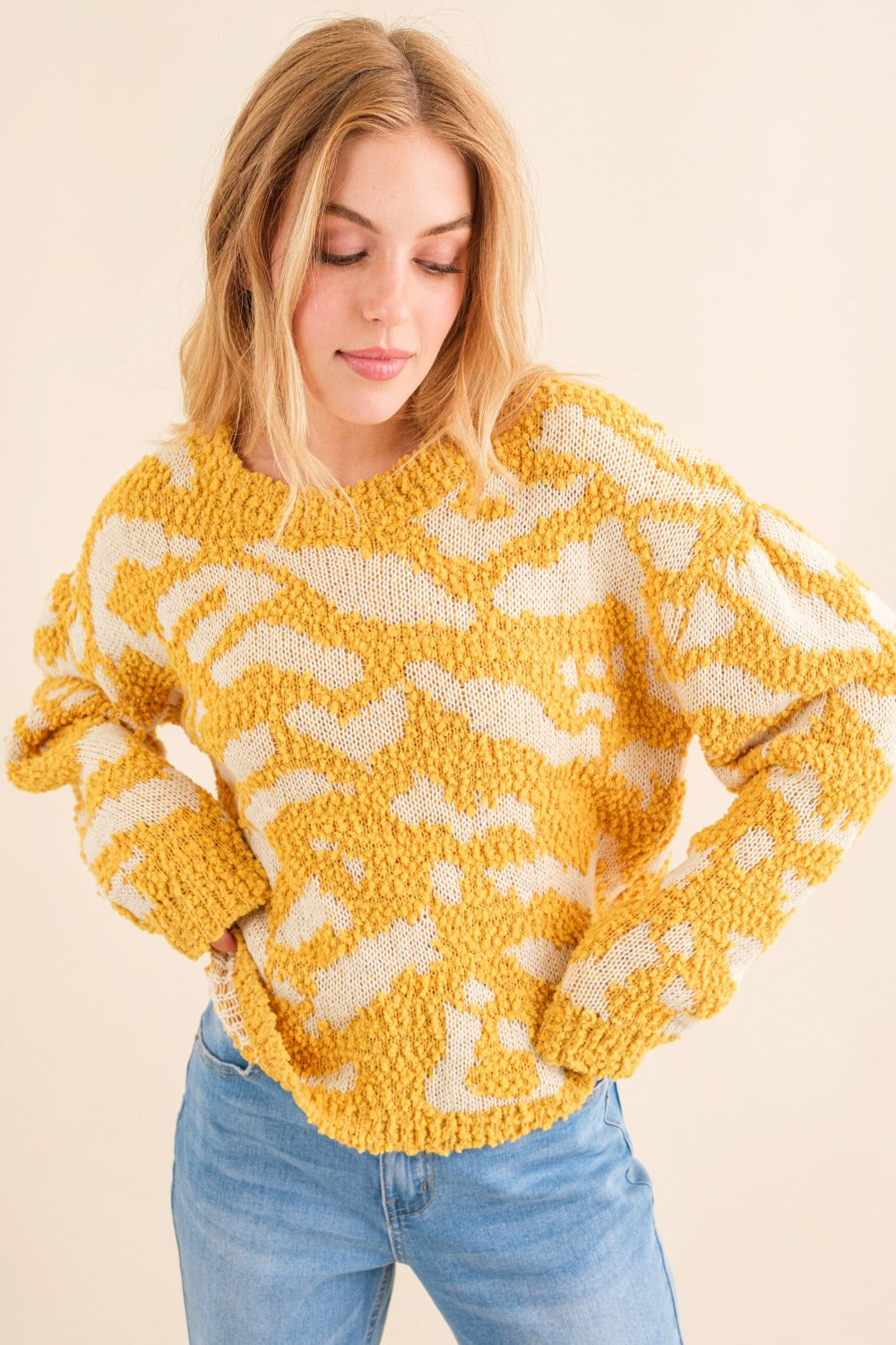 Yellow textured pattern sweater with white contrast, front view