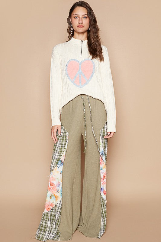 Full outfit with Tranquil Harmony Cable-Knit Sweater and floral pants